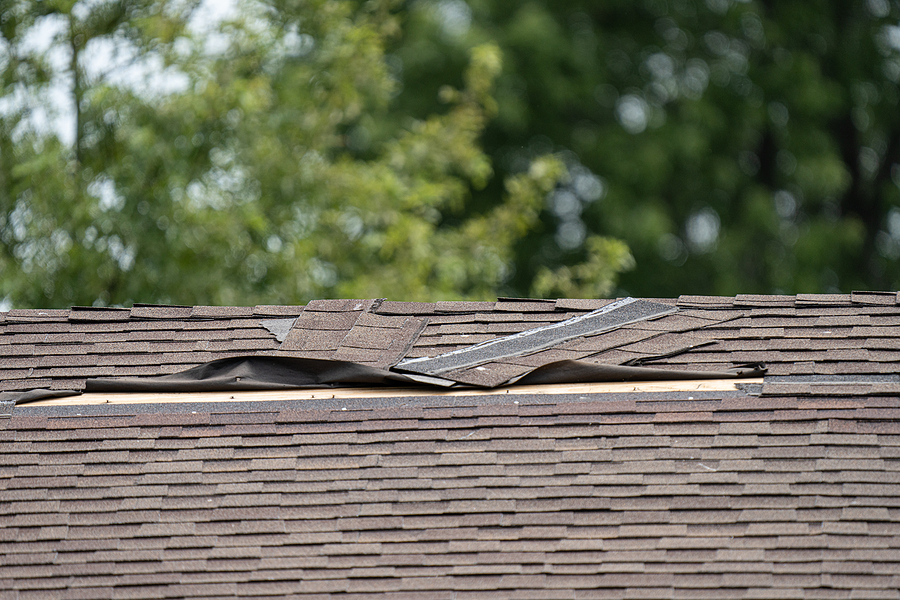 Roof Shingles Have Been Damaged By Heavy Winds And Strong Storms
